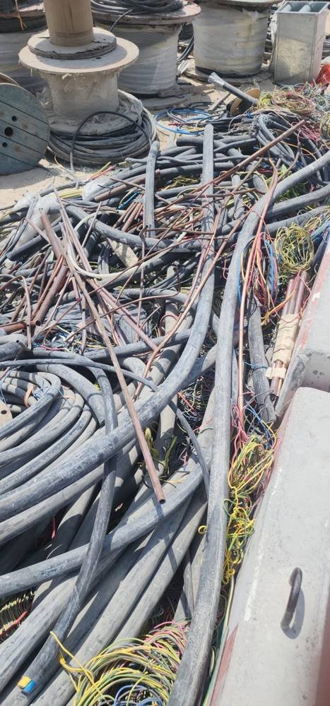 Pile of scrap electrical cables and copper pipes